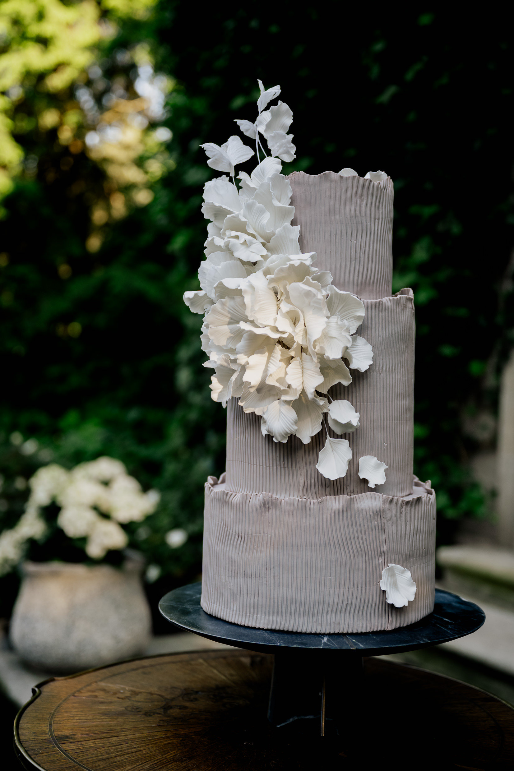 Wedding cake with floral design created by Sweet Details in Michigan.