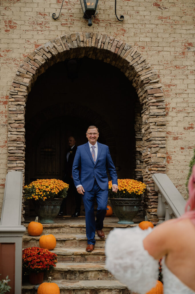 The bride shares a first look moment with the father of the bride.